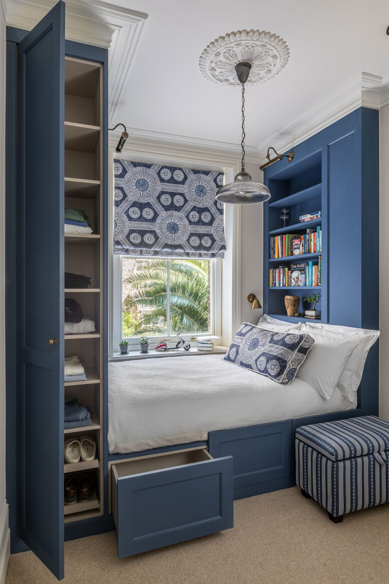 Built-in cabin bed with integrated wardrobe and drawers